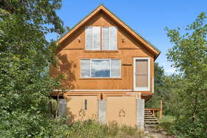 View of home's exterior featuring stairway