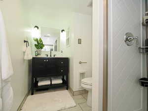 Full bathroom featuring vanity and tile patterned flooring