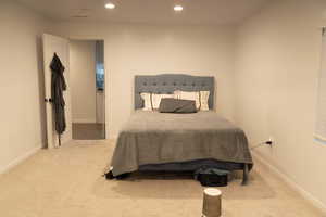 Bedroom with carpet floors and recessed lighting