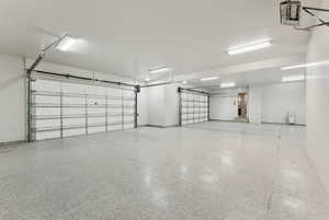 Garage featuring baseboards