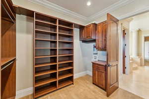 Walk in closet featuring decorative columns