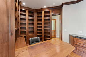 Home office featuring ornamental molding, recessed lighting, and wood finished floors