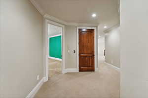 Hall featuring crown molding, carpet flooring, and recessed lighting