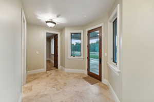 Foyer entrance with baseboards