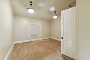 Empty room featuring carpet