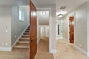 Stairs featuring carpet floors