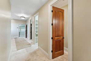 Hall featuring baseboards
