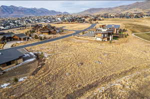 Aerial view of residential area featuring a mountain backdrop
