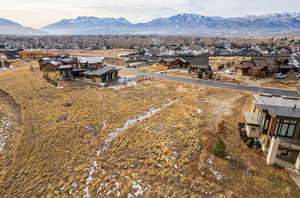 Aerial perspective of suburban area with a mountain backdrop