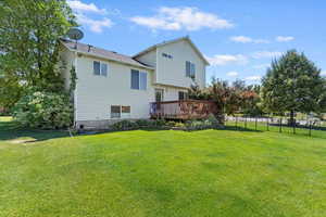 Back of house with a wooden deck