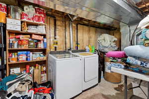 Unfinished basement featuring separate washer and dryer