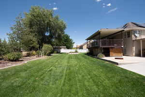 View of yard with a patio area