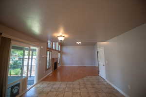 Unfurnished living room featuring a fireplace and light wood finished floors