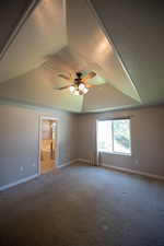 Carpeted spare room with ceiling fan and a textured ceiling