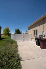 View of patio featuring a gate