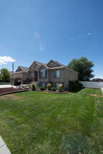 View of front of house with stucco siding and stone siding