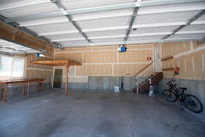 Garage featuring a garage door opener