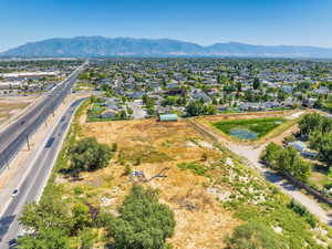 Aerial perspective of suburban area with a mountain backdrop