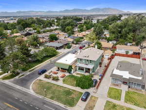Aerial perspective of suburban area featuring a mountainous background