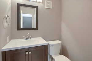Half bath with toilet and vanity