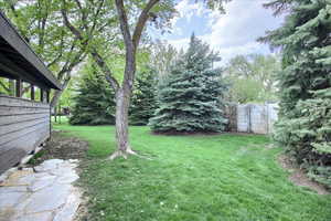 enormous view of yard with view of wooded area