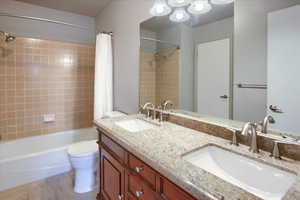Master bathroom with shower / bath combo and double vanity