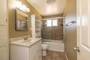 Full bathroom with vanity and washtub / shower combination