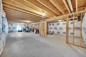 Large open unfinished basement plumbed for a bathroom and a wetbar.