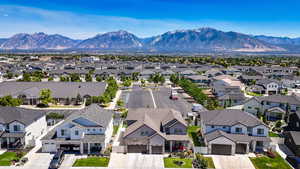 Aerial view of residential area featuring mountains