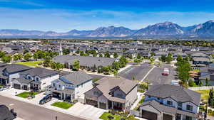 Aerial view of residential area featuring a mountainous background
