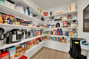 Over sized pantry can be converted to a butlers pantry
