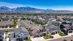 Aerial view of residential area featuring a mountain backdrop