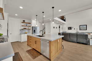 Oversized kitchen island with WIFI controlled sink faucet with no touch on/off , dishwasher, and pull out garbage cabinet.