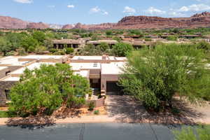 View of mountain backdrop with nearby suburban area