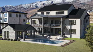 Back of property with a balcony, stone siding, stairway, a mountain view, and a standing seam roof