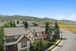 View of mountain background featuring nearby suburban area