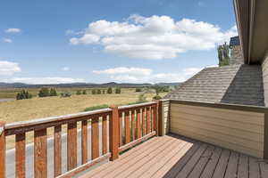 Wooden terrace with a mountain view and a view of countryside