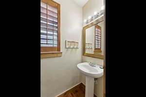 Bathroom with plenty of natural light and wood finished floors