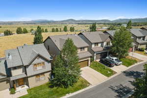 Aerial perspective of suburban area featuring a mountain backdrop