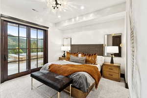 Bedroom with a chandelier, access to exterior, carpet flooring, and recessed lighting