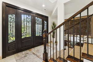 Foyer with french doors and stairway