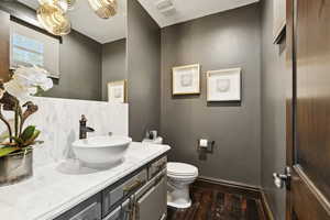 Bathroom with wood finished floors and vanity