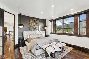 Bedroom featuring dark wood finished floors and recessed lighting
