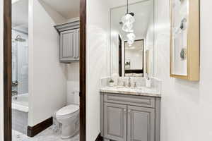 Full bath featuring vanity and bathtub / shower combination