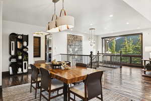 Dining space featuring hardwood / wood-style flooring and recessed lighting