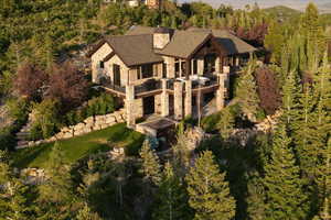 View of subject property with a heavily wooded area