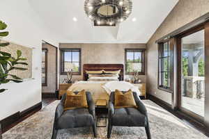 Bedroom with lofted ceiling, wood finished floors, multiple windows, access to exterior, and recessed lighting