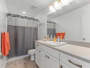 Bathroom featuring toilet and vanity