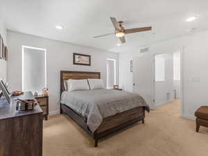 Bedroom featuring light colored carpet, recessed lighting, and ceiling fan