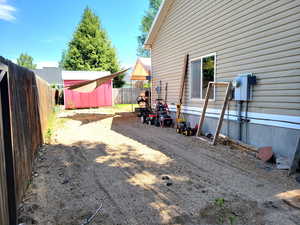 Fenced backyard with a shed
